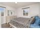 Bedroom with a large bed, dresser, and ample natural light from surrounding windows for a bright and airy feel at 4930 Crestmont Dr, Charlotte, NC 28205