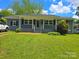 Charming home featuring well-maintained landscaping, a covered porch, and a classic design at 4930 Crestmont Dr, Charlotte, NC 28205