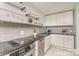 Updated kitchen with stainless steel appliances, sleek countertops, and stylish tile backsplash at 4930 Crestmont Dr, Charlotte, NC 28205