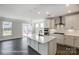 Spacious kitchen boasts a large center island, stainless steel appliances, and lots of natural light at 5104 Heathland Dr # 73, Charlotte, NC 28215