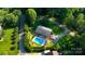 Aerial view of a home with a backyard pool, a fenced-in yard, and driveway parking at 6108 Gold Creek Estate Dr, Hickory, NC 28601