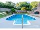 Backyard swimming pool with a concrete deck and well-maintained lawn at 6108 Gold Creek Estate Dr, Hickory, NC 28601