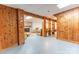 Finished basement with wood paneled walls and open concept at 6108 Gold Creek Estate Dr, Hickory, NC 28601