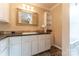 Bathroom vanity with white cabinetry, sleek hardware, and a built-in shelving unit at 6108 Gold Creek Estate Dr, Hickory, NC 28601