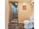 Bathroom featuring a toilet, shower, and tiled floors at 6108 Gold Creek Estate Dr, Hickory, NC 28601