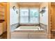Relaxing bath with large window for natural light at 6108 Gold Creek Estate Dr, Hickory, NC 28601