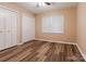 Cozy bedroom with closet and wood-look floors at 6108 Gold Creek Estate Dr, Hickory, NC 28601