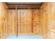 Wood-paneled walk-in closet with a hanging rod and shelving at 6108 Gold Creek Estate Dr, Hickory, NC 28601