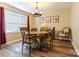 Cozy dining room featuring a round table, decorative chairs, and natural light at 6108 Gold Creek Estate Dr, Hickory, NC 28601