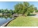 Dock on the lake, complemented by a large shade tree and a picnic table at 6108 Gold Creek Estate Dr, Hickory, NC 28601