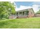 A charming home with a covered front porch and a well-maintained yard at 6108 Gold Creek Estate Dr, Hickory, NC 28601