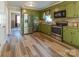 Charming kitchen with stainless steel appliances, wood flooring, and an open layout to the dining area at 6108 Gold Creek Estate Dr, Hickory, NC 28601