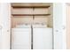 Convenient laundry closet with stacked washer and dryer, perfect for saving space in your home at 6108 Gold Creek Estate Dr, Hickory, NC 28601