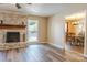 Open-concept living room with adjacent dining area and fireplace at 6108 Gold Creek Estate Dr, Hickory, NC 28601