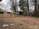 View of the fenced backyard with a storage shed at 818 W 6Th St, Newton, NC 28658