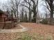 View of the backyard with a path and a trampoline in the background at 818 W 6Th St, Newton, NC 28658