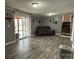 Finished basement area with sliding door, recessed lights, and vinyl flooring at 818 W 6Th St, Newton, NC 28658