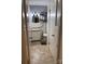 Compact bathroom features a white vanity, toilet, and a tiled floor at 818 W 6Th St, Newton, NC 28658