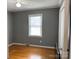 Bedroom with hardwood floors and a window offering natural light at 818 W 6Th St, Newton, NC 28658