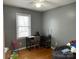 Bedroom featuring hardwood floors and a desk area, ideal for study at 818 W 6Th St, Newton, NC 28658