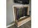 Close-up of a fireplace with decorative tile and a mantel at 818 W 6Th St, Newton, NC 28658