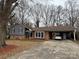 Charming single-story home with a brick and siding facade, complimented by a covered carport for convenient parking at 818 W 6Th St, Newton, NC 28658
