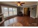 Inviting living room with hardwood floors, a decorative fireplace, and large windows providing ample natural light at 818 W 6Th St, Newton, NC 28658