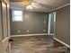 Open room with laminate flooring and a ceiling fan for comfort at 818 W 6Th St, Newton, NC 28658