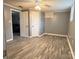 Spacious room with laminate flooring and an adjacent room at 818 W 6Th St, Newton, NC 28658