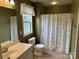 Traditional bathroom featuring a toilet, sink and tiled shower/tub combo at 823 Prestwick Dr, Rock Hill, SC 29730