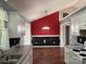 Bright dining room with tile accent wall, hardwood flooring, and modern chandelier at 823 Prestwick Dr, Rock Hill, SC 29730