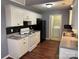 Charming kitchen with appliances, white cabinets, tile backsplash and a laundry area right off the kitchen at 823 Prestwick Dr, Rock Hill, SC 29730