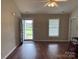 View of the front entry door as well as the hardwood flooring and two windows for plenty of natural light at 823 Prestwick Dr, Rock Hill, SC 29730