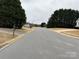 Wide, tree-lined street view showcasing the peaceful neighborhood and curb appeal at 823 Prestwick Dr, Rock Hill, SC 29730