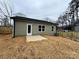 Well-maintained backyard featuring a wooden privacy fence and freshly mulched landscaping at 916 Moose St, Lowell, NC 28098