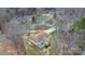 Aerial view of a house with a large lot, featuring a deck and a spacious yard surrounded by mature trees at 920 Hunting Ave, Lincolnton, NC 28092
