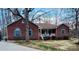 Charming brick home featuring blue shutters and a cozy front porch at 920 Hunting Ave, Lincolnton, NC 28092