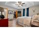 Inviting main bedroom featuring tray ceiling, walk-in closet, and wood-look floors at 920 Hunting Ave, Lincolnton, NC 28092