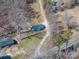 Aerial view of a charming blue house surrounded by lush greenery and trees at 939 Dameron Rd, Bessemer City, NC 28016