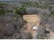 Scenic aerial view of a barn, pasture and wooded land at 939 Dameron Rd, Bessemer City, NC 28016
