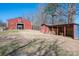 Exterior view of the barn, shed, storage area, firepit, and fields at 939 Dameron Rd, Bessemer City, NC 28016