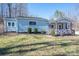Charming blue home with a lovely front porch and well-maintained lawn at 939 Dameron Rd, Bessemer City, NC 28016