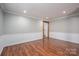 Bright living room with hardwood floors, neutral walls, and classic trim detail at 939 Dameron Rd, Bessemer City, NC 28016