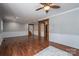 Spacious living room with wood-look floors, neutral walls, and ample natural light at 939 Dameron Rd, Bessemer City, NC 28016