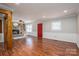 Inviting living room with a stone fireplace, hardwood floors, and neutral color palette at 939 Dameron Rd, Bessemer City, NC 28016