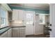 Mud room with white cabinets, a gray countertop, a door to the outside, and a window at 939 Dameron Rd, Bessemer City, NC 28016