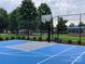 Community basketball court with trees and green spaces nearby at 9760 Springholm Dr, Charlotte, NC 28278