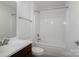 Bathroom includes vanity with sink, toilet, and shower over tub at 9760 Springholm Dr, Charlotte, NC 28278