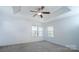 Spacious bedroom with a tray ceiling and lots of natural light at 9760 Springholm Dr, Charlotte, NC 28278
