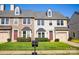 Charming townhomes with manicured lawns, inviting entrances, and well-maintained exteriors, perfect for Gathering living at 9760 Springholm Dr, Charlotte, NC 28278